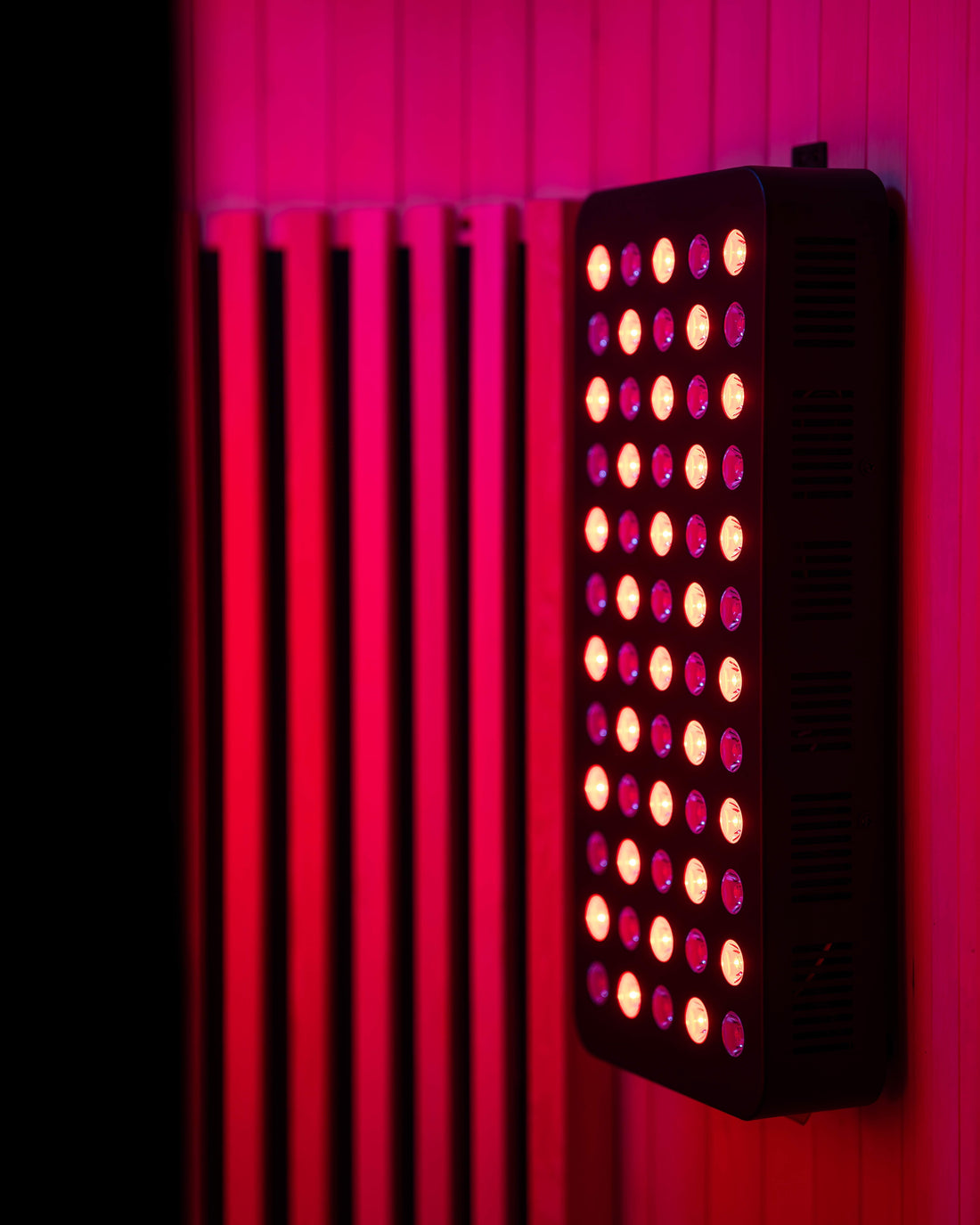 Close-up of the red light therapy panel inside the Sun Home Pod infrared sauna
