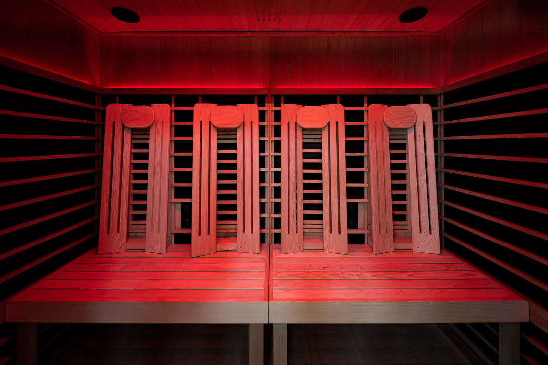 Interior of the Sun Home Eclipse 4-person infrared sauna with red chromotherapy lighting and four backrests
