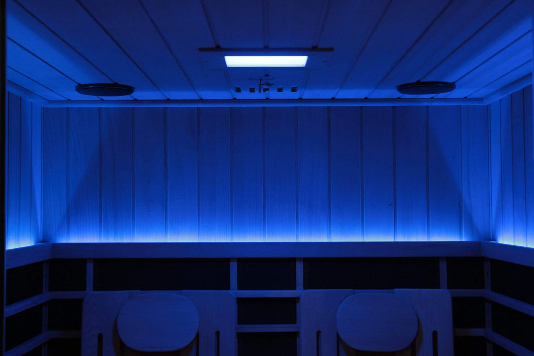 Sun Home Eclipse 2-person red light infrared sauna interior lit in blue chromotherapy with two backrests